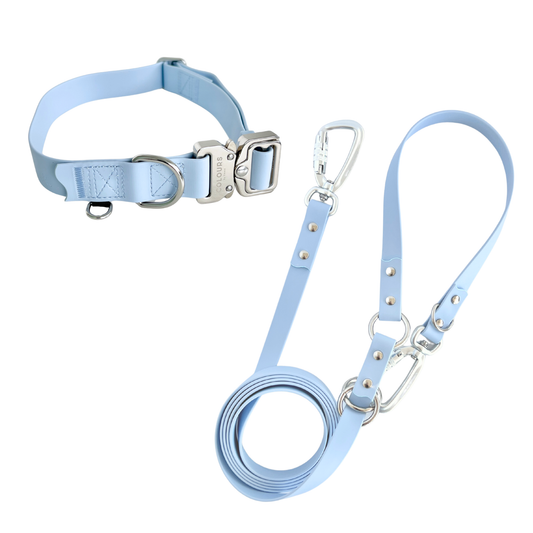 Light blue dog collar and leash set on a white background